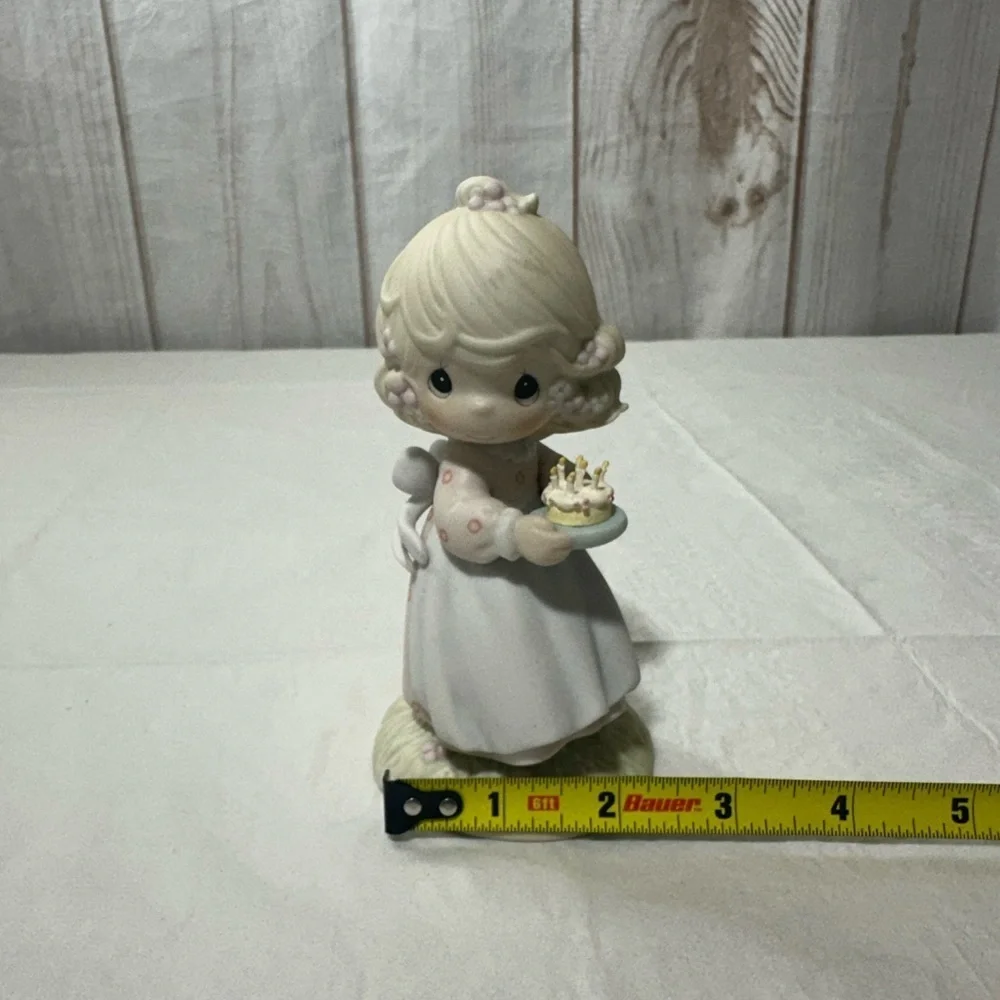 Precious Moment’s figurine titled “May Your Birthday Be A Blessing” from 1990